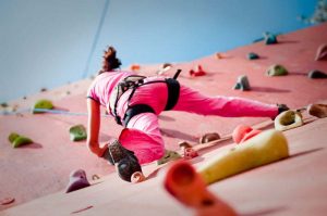 A girl doing wall Climbing at PLaY
