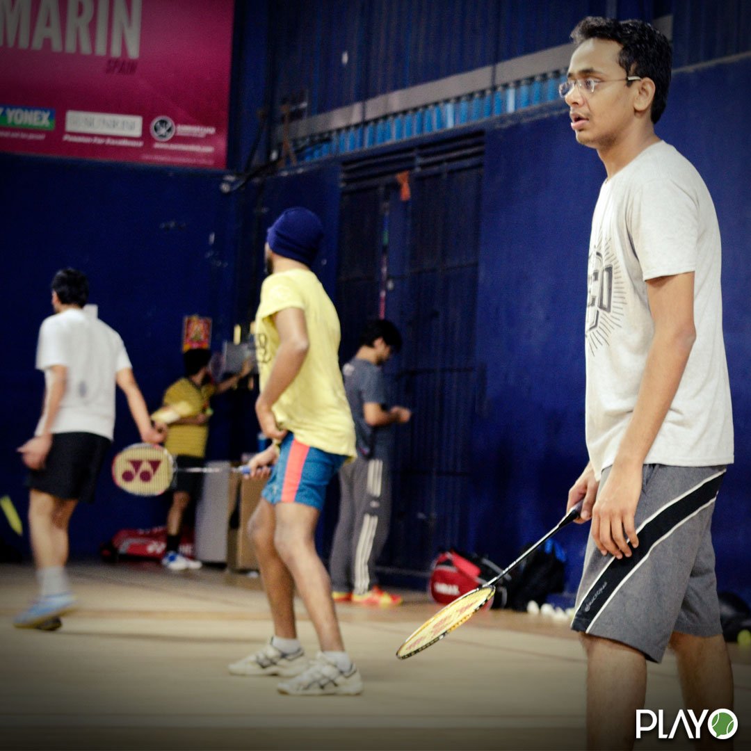 Badminton players on the court