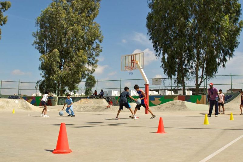 People engaged in Playing Basketball at Play