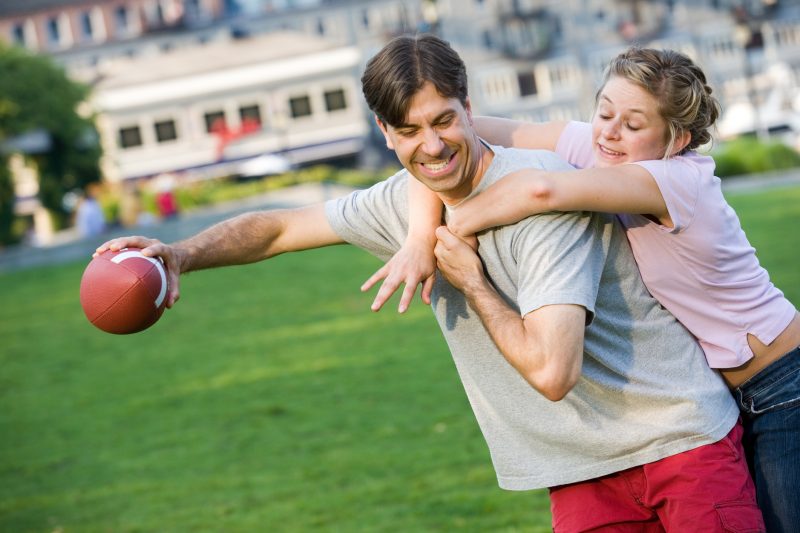 Couple-Playing-Football