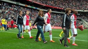Ajax Players walk out with their mothers ahead of their final home game at Cambuur