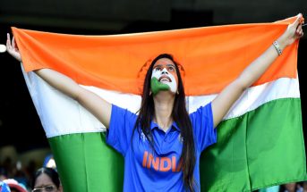 a cricket fan cheering for india