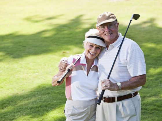 Senior couple playing golf
