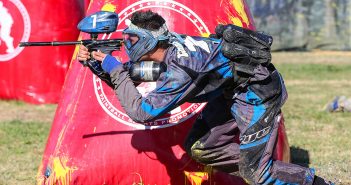 person taking a shot at paintball