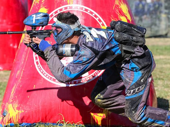 person taking a shot at paintball
