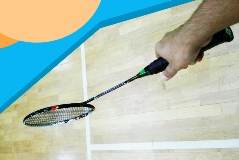 holding badminton racket