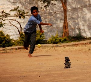 kid playing lagori