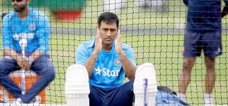 Dhoni making hand gestures